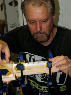 Merrill Lund, LMT, owner of Career Extenders Therapy Tools, building the "Best Friend" tool in his workshop.