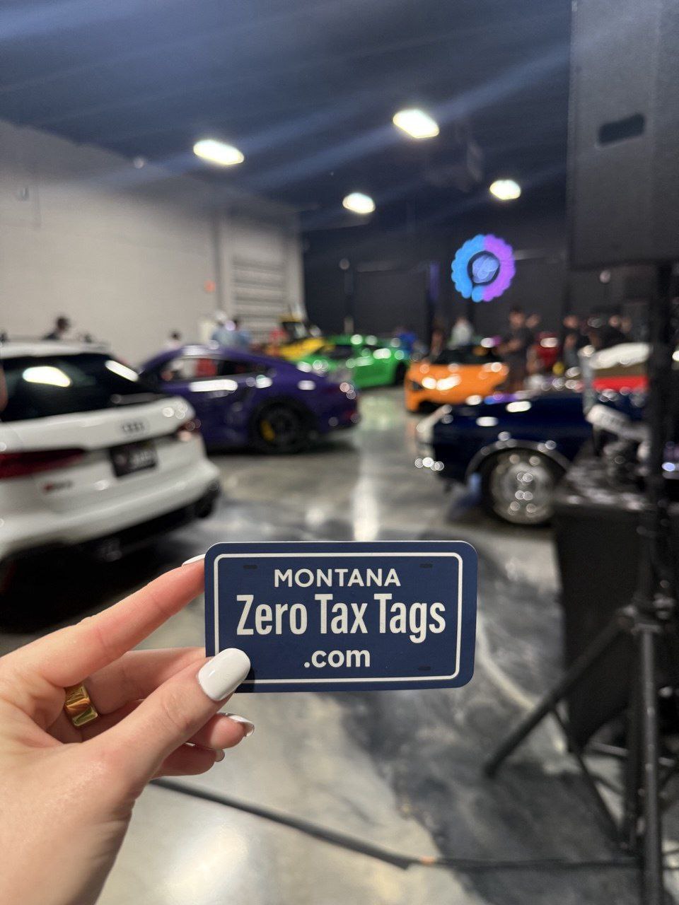 ZeroTaxTags business card with luxury vehicles Montana LLC registration